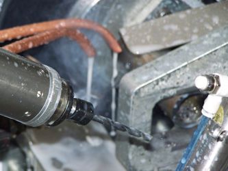 Tube drilling machine
